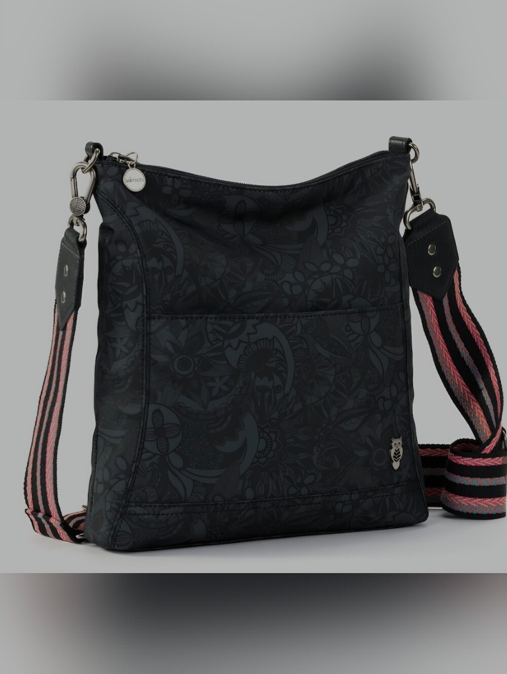 Sakroots Lucia Crossbody in black with a patterned strap and matching keychain